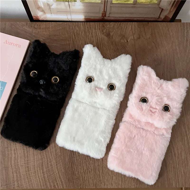 three cell phones with cat eyes on them